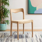 Sedia da pranzo con seduta in vimini e schienale in legno intagliato, 53 cm L x 46 cm P x 79 cm H