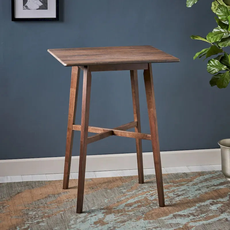 Tavolo da pranzo alto con gambe in legno di hevea e piano laminato